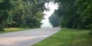 Image along the Colonial Parkway dramatizing the scenic, natural setting of the roadway Image along the Colonial Parkway dramatizing the scenic, natural setting of the roadway