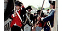 2 men in fine trimmed coats walk through a gate saluting with swords 2 men in fine trimmed coats walk through a gate saluting with swords