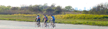 Bicyclists on one of the old airport runways at Floyd Bennett Field in Brooklyn.