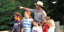 Ranger and children at park overlook Ranger and children at park overlook