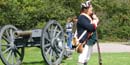 A park volunteer, dressed as an American soldier, helps orient visitors to what they are seeing. A park volunteer, dressed as an American soldier, helps orient visitors to what they are seeing.