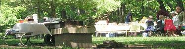 Visitors enjoying their lunch outside at the Big Meadows picnic area.
