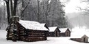 The huts used by Washington's guard, framed by falling snow. The huts used by Washington's guard, framed by falling snow.