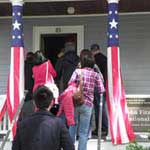 Visitors enter house