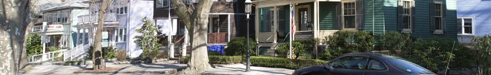 A photograph of the front of the John Fitzgerald Kennedy birthplace and surrounding houses on Beals Street