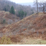 The North and South abutments of the South Fork Dam are all that remain of the once 931-foot long structure.