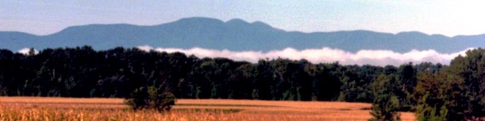 Mist rises over fields on Martin Van Buren's farm Lindenwald as the Catkill Mountains loom in the distance.