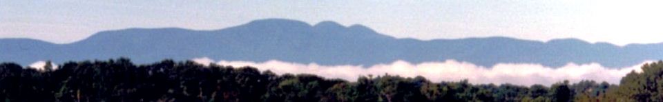 Mist rises over fields on Martin Van Buren's farm Lindenwald as the Catkill Mountains loom in the distance.