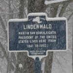 A state historic marker on on a snowy day on Old Post Road in front of Lindenwald.