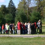 A group tour speaking with a ranger prior to a tour.