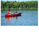 An adult and 2 children canoeing