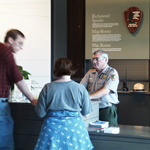 Park ranger greeting visitors Park ranger greeting visitors