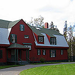Roosevelt's red cottage with green trim