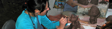 A participant enjoys a scupting workshop at the park.