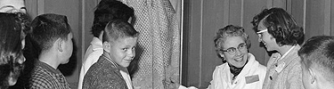 A school group in the Derby house, c. 1955. NPS photo.