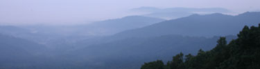 Fog from the valley meets the mountain and creates a scenic splendor.