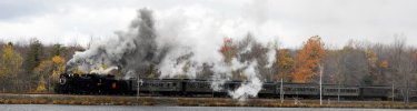 CN 3254 rolls past one of the many lakes in the Pocono Mountains on one of Steamtown's many excursions.  (NPS Photo, Ken Ganz)