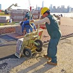 Workers restore walkway in front of the Statue of Liberty.