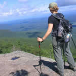 A hiker overlooking a scenic mountain valley