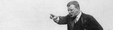 Theodore makes a point during a speech.