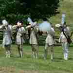 Soldiers firing muskets