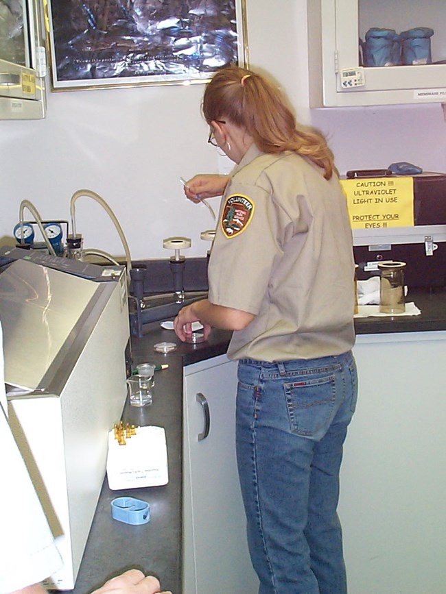 Volunteer assisting in resource management lab