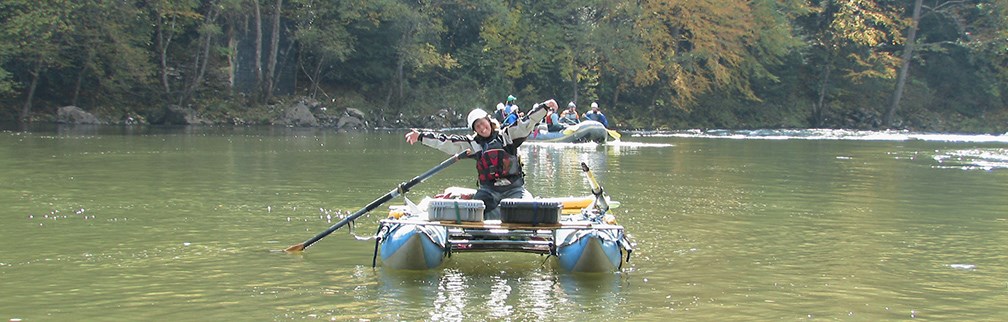 ranger in raft on the river