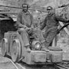 historic photo of miners at mine entrance