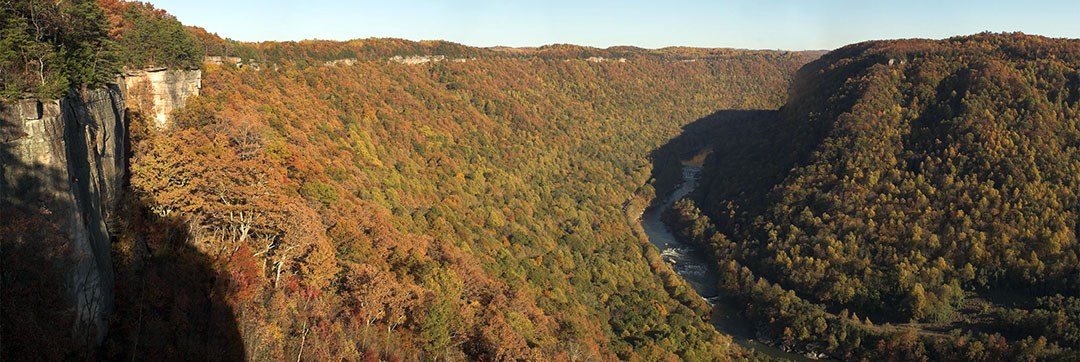 view of river and gorge with early fall colors