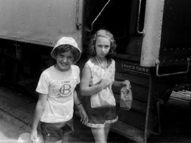 young girls boarding a train
