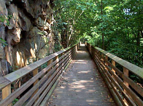 Wood decked railroad trestle along the trail