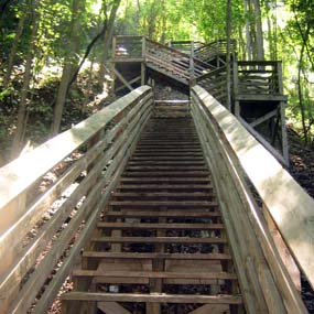 wooden steps descend to the bottom of the gorge