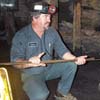 miner leading tour of coal mine