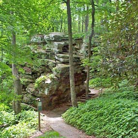 boulder at trail junction