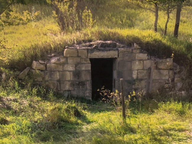 A dug out shelter built into a hill side