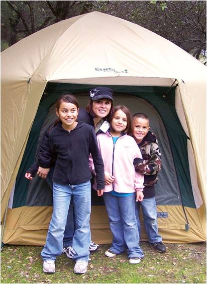 A family enjoys camping for the first time.
