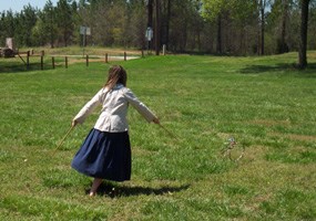 Girl playing a Colonial game