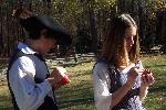 Teen reenactors making pomanders
