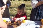 Child making colonial pomander