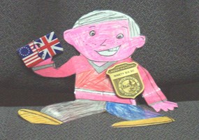 Flat Stanley with Jr Ranger badge and flags