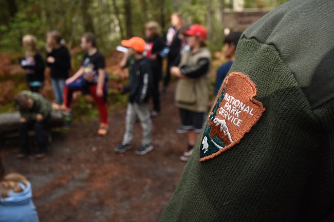 NPS Patch with students in background