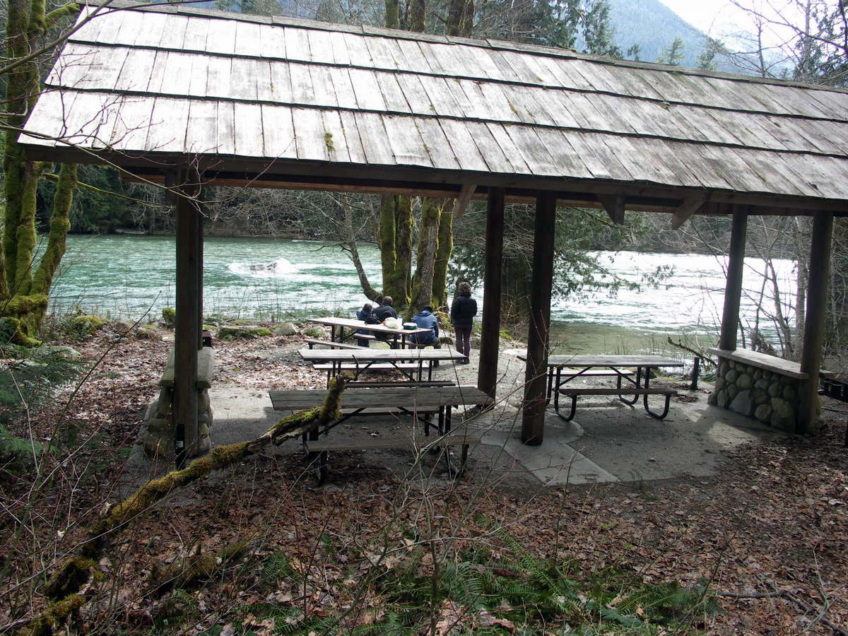 Family at Goodell Campground picnic shelter next to the Skagit River