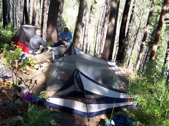 Backpacking tents set up at camp.