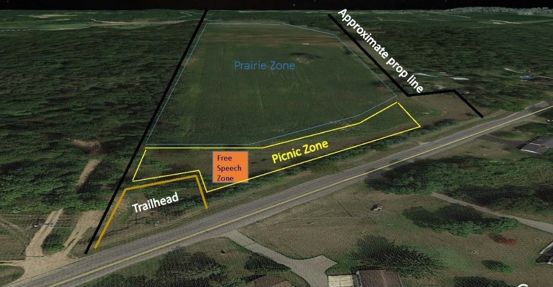 Aerial map with an orange polygon labeled Free Speech Zone between areas marked "trailhead" and "picnic zone"