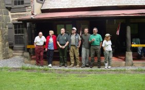 volunteers pose for after trail work picture