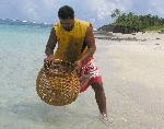 Ofu fisherman with basket fish trap
