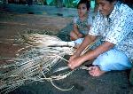 Vaimoso woman weaving a fine mat