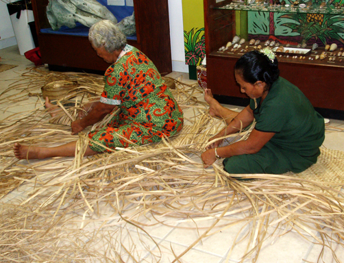 Samoan women weaving fine mats.