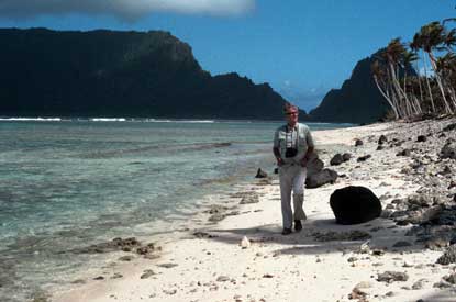 A beachwalker along the miles of white sand shoreline on Olosega.