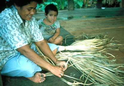 Samoan woman weaving a finemat.